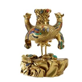 A RARE HARDSTONE AND GLASS-INLAID GILT-BRONZE PHOENIX-FORM CANDLE HOLDER