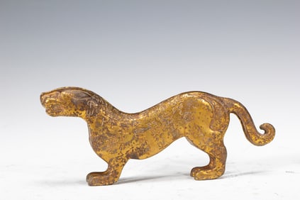 A BRONZE-GILT TIGER FINIAL