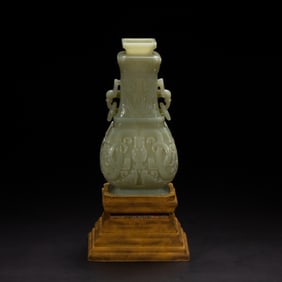 A CARVED JADE VESSEL HU