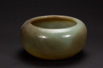 A CARVED JADE WASHER