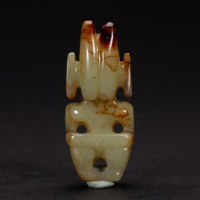A CARVED JADE MYTHICAL FIGURE
