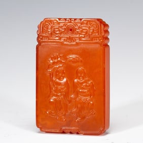 A CARVED AMBER IMMORTALS PLAQUE