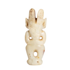 A JADE CARVING OF MYTHICAL FIGURE