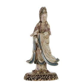 A CARVED SHOUSHAN STONE STANDING GUANYIN