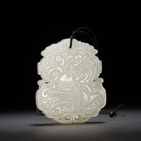 A CARVED WHITE JADE PLAQUE