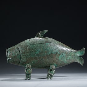 A BRONZE FISH-FORM VESSEL