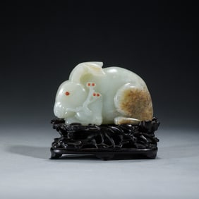 A CARVED WHITE JADE RABBIT