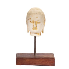 A CARVED MARBLE BUDDHA HEAD