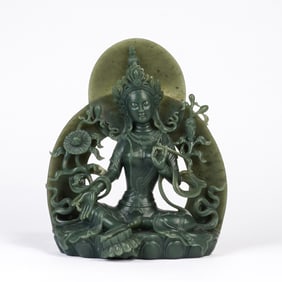 A CARVED SPINACH GREEN JADE GREEN TARA