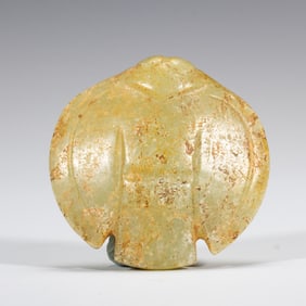A CARVED YELLOW JADE MYTHICAL BIRD