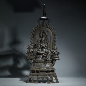 A COPPER ALLOY SEATED GREEN TARA