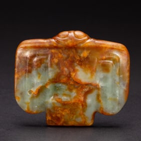 A RARE CARVED JADE MYTHICAL BIRD