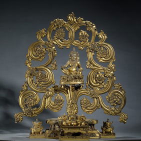 A BRONZE-GILT JAMBHALA