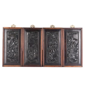 A SET OF FOUR CARVED ROSEWOOD HANGING PANELS