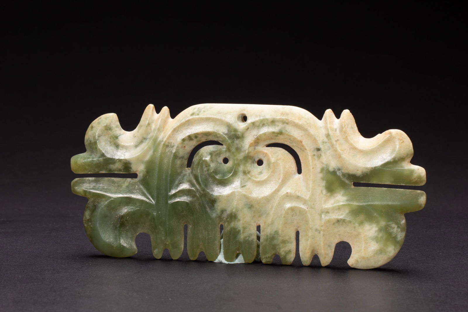 A VERY RARE GREEN JADE TOOTHED ANIMAL MASK ORNAMENT (1 of 9)