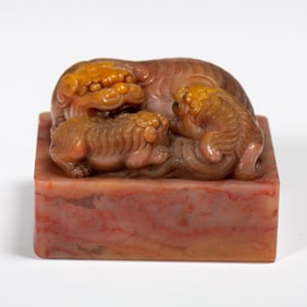 A CARVED SHOUSHAN STONE LIONS GROUP SEAL
