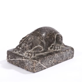 A CARVED STONE MYTHICAL BEAST