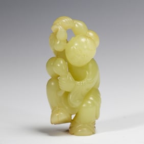 A FINE CARVED YELLOW JADE BOY