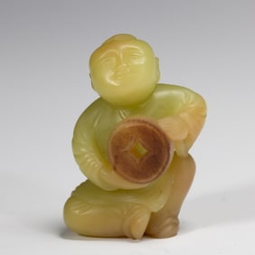 A FINE CARVED YELLOW JADE BOY
