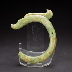 A VERY RARE CARVED JADE C-DRAGON