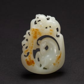A CARVED WHITE JADE HORSE PLAQUE