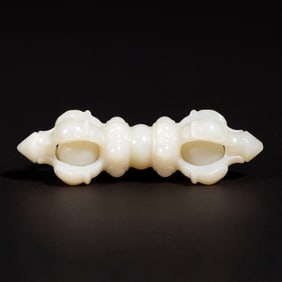 A CARVED WHITE JADE VAJRA