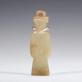 A CARVED JADE STANDING FIGURE