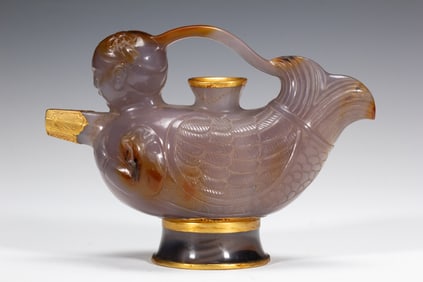 A CARVED AGATE MAKARA EWER