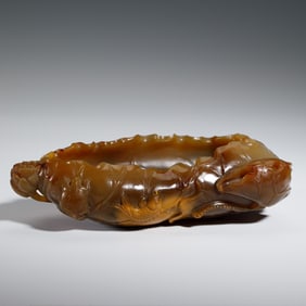 A CARVED AGATE LOTUS LEAF FORM WASHER