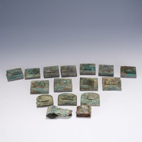 A SET OF BRONZE BELT ORNAMNES