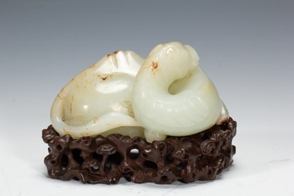 A CARVED WHITE JADE CAMEL