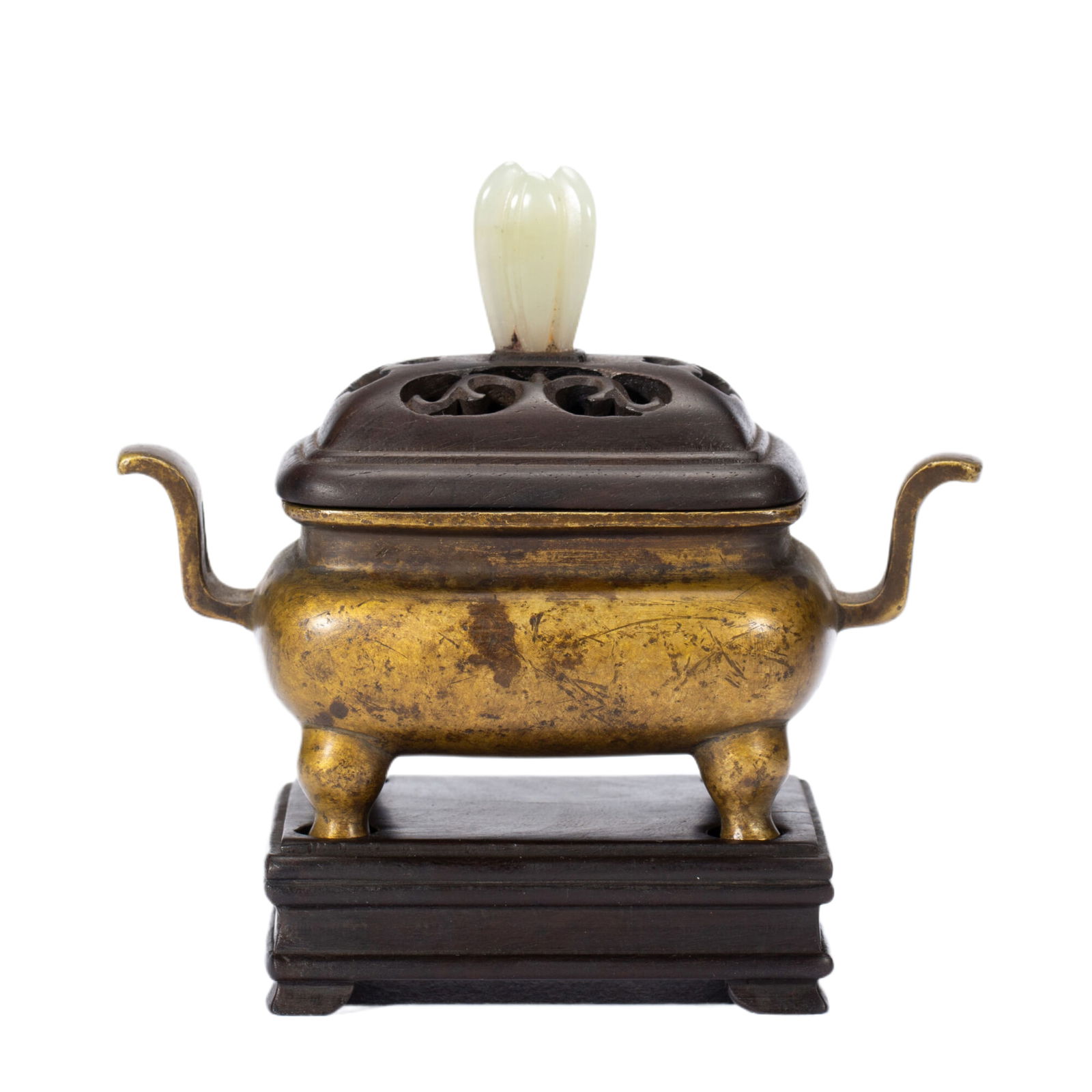 A BRONZE INCENSE BURNER: A BRONZE INCENSE BURNER The compressed globular censer is casted with a curved, upright handles, and the domed cover is surmounted by a carved jade finial. Dimension: L. 10 cm. W. 5.5 cm. H. 9.5 cm. W
