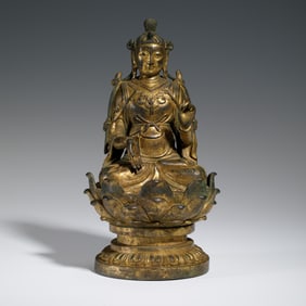 A BRONZE-GILT SEATED BODHISATTVA