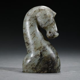A CARVED JADE HORSE-HEAD DAGGER HANDLE