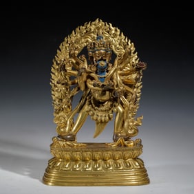 A sino-tibetan bronze-gilt figure of CAKRASAMVARA