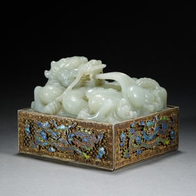 A CARVED WHITE JADE DRAGON SEAL