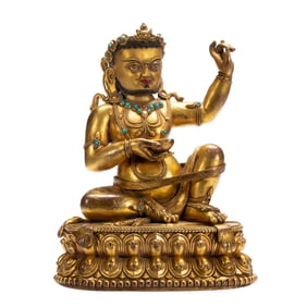 A TIBETAN HARDSTONES INLAID BRONZE-GILT SIDDHA