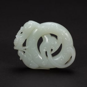 A CARVED WHITE JADE CHILONG DISC