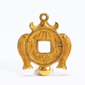 A BRONZE-GILT ORNAMENT