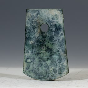 A CARVED JADE BLADE AXE