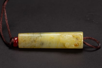 A CARVED JADE ORNAMENT