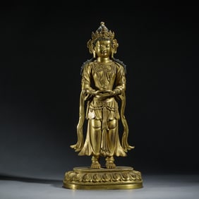 A BRONZE-GILT STANDING BODHISATTVA