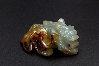 A CARVED JADE MYTHICAL BEAST BIXIU
