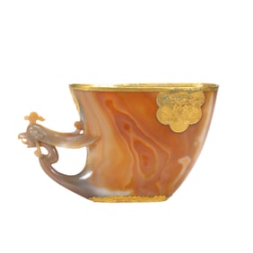 A CARVED AGATE PHOENIX HEAD LIBATION CUP