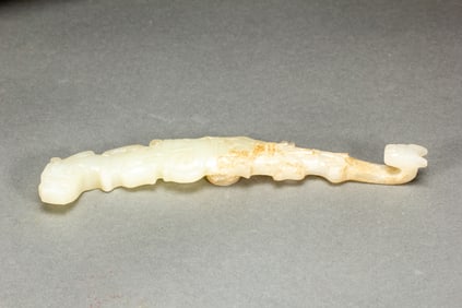 A CARVED WHITE JADE BELTHOOK