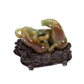 A CARVED JADE HORSES GROUP