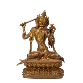A SINO-TIBETAN BRONZE-GILT FIGURE OF MANJUSRI