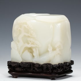 A CARVED WHITE JADE DECORATION