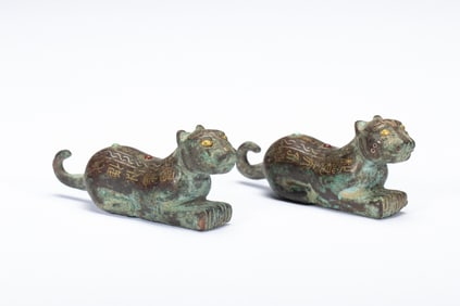 PAIR GOLD AND SILVER DECORATED TIGER FINIALS