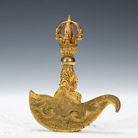 A BRONZE-GILT CURVED KNIFE